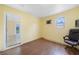 Bright, airy bedroom showcases laminate flooring and a doorway to the outdoor living space at 4371 Tollefson Ave, North Port, FL 34287