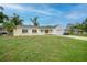 Charming single-story home with a well-manicured lawn and an attached one-car garage at 4371 Tollefson Ave, North Port, FL 34287