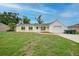 Charming one-story home with a well-maintained lawn and a bright yellow exterior at 4371 Tollefson Ave, North Port, FL 34287