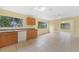 Bright kitchen featuring tiled floors, cabinetry and a view into the next room at 4371 Tollefson Ave, North Port, FL 34287