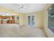 Open-concept kitchen and eating area with a ceiling fan and plenty of natural light at 4371 Tollefson Ave, North Port, FL 34287