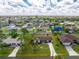 Charming single-story home with a well-manicured lawn and mature trees in a quiet neighborhood at 4399 Mundella Cir, Port Charlotte, FL 33948