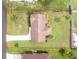 An aerial view of a property that features a large, well-maintained yard and mature landscaping at 4399 Mundella Cir, Port Charlotte, FL 33948