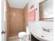 Well-lit bathroom features a tiled shower, a modern sink, and updated fixtures at 4399 Mundella Cir, Port Charlotte, FL 33948