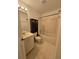 Full bathroom featuring a vanity, toilet, and a shower-tub combo at 4900 Hurley Ave, North Port, FL 34288