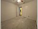 Bedroom featuring an open closet, white trim, and a view into an adjoining bathroom at 4900 Hurley Ave, North Port, FL 34288