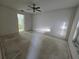 Spacious bedroom featuring a ceiling fan and an ensuite bathroom at 4900 Hurley Ave, North Port, FL 34288