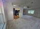 Open concept living area with kitchen view and natural light at 4900 Hurley Ave, North Port, FL 34288