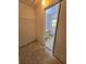 Large walk-in closet leading into the bathroom area at 4900 Hurley Ave, North Port, FL 34288