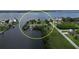 Scenic aerial view of the waterfront property with lush greenery and deep water access via two docks at 5412 Ulysses St, Port Charlotte, FL 33981