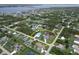 Residential area aerial view with water in the distance; property outlined in yellow shows home and detached garage at 5412 Ulysses St, Port Charlotte, FL 33981