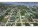 Aerial view of home outlined in yellow with detached garage situated in a developed neighborhood at 5412 Ulysses St, Port Charlotte, FL 33981