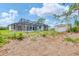 Backyard featuring an enclosed pool area, lush greenery, and additional storage shed on the property at 5412 Ulysses St, Port Charlotte, FL 33981