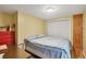 Simple bedroom with cozy bed, closet, and warm lighting at 5412 Ulysses St, Port Charlotte, FL 33981