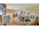 A cozy living space features hardwood floors, a kitchen, and a comfortable armchair at 5412 Ulysses St, Port Charlotte, FL 33981