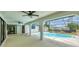 Screened in lanai with inground pool, covered patio, and view of backyard at 5412 Ulysses St, Port Charlotte, FL 33981