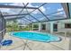 Inviting screened-in pool area with crystal clear water, covered patio, and ample deck space at 5412 Ulysses St, Port Charlotte, FL 33981