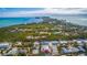 Expansive aerial view of the property, coastline, and neighborhood at 608 Saint Judes Dr, Longboat Key, FL 34228