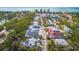 Captivating aerial view showcasing the community, lush greenery, and surrounding landscape at 608 Saint Judes Dr, Longboat Key, FL 34228