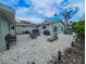 An expansive outdoor space, complete with seating, barbecue, and lush foliage at 608 Saint Judes Dr, Longboat Key, FL 34228