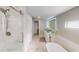 Modern bathroom featuring dual vessel sinks, large shower, and soaking tub at 608 Saint Judes Dr, Longboat Key, FL 34228