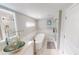 Luxurious bathroom features a modern soaking tub, glass bowl sink, and a spacious walk-in shower at 608 Saint Judes Dr, Longboat Key, FL 34228