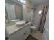 Bathroom features a vessel sink, tiled shower, and modern fixtures in a well-lit space at 608 Saint Judes Dr, Longboat Key, FL 34228