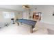 Entertain in the game room featuring a billiard table and ample space at 608 Saint Judes Dr, Longboat Key, FL 34228
