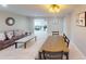 Spacious living area open to dining area, neutral paint, and tile floors at 608 Saint Judes Dr, Longboat Key, FL 34228
