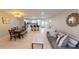Open living area with tile floors, stylish furnishings, and a dining area at 608 Saint Judes Dr, Longboat Key, FL 34228