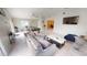 Bright and airy living room that opens to the game room and dining area at 608 Saint Judes Dr, Longboat Key, FL 34228