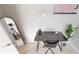 Bright office space featuring a sleek black desk, comfortable chair, and modern artwork at 608 Saint Judes Dr, Longboat Key, FL 34228