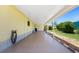 Large carport featuring direct access to the side entry of the home and pebble landscaping at 6293 Sparrow Ln, Englewood, FL 34224