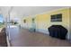 The spacious carport features a BBQ and direct access to the home's side entry at 6293 Sparrow Ln, Englewood, FL 34224