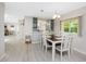 Inviting dining area with built-in shelving, perfect for Gathering meals and gatherings at 6293 Sparrow Ln, Englewood, FL 34224