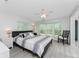 Spacious main bedroom features large windows offering plenty of natural light and backyard views at 6293 Sparrow Ln, Englewood, FL 34224