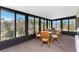 Sun room with a glass table, chairs, and large windows, inviting lots of natural lighting at 6293 Sparrow Ln, Englewood, FL 34224