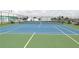 Exterior view of the community tennis court, perfect for sports enthusiasts at 6293 Sparrow Ln, Englewood, FL 34224