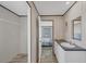Bathroom with vanity, sink, and view into an adjacent bedroom at 7337 Desant Ln, Port Charlotte, FL 33981
