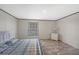 Well-lit main bedroom has one window, and neutral decor at 7337 Desant Ln, Port Charlotte, FL 33981