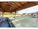 A shaded Bocce Ball court with benches surrounding the court for observers in an active adult community at 7337 Desant Ln, Port Charlotte, FL 33981