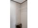 Paneled closet with a white wire shelf, tv, and remote at 7337 Desant Ln, Port Charlotte, FL 33981