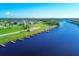 Aerial view of community boat docks alongside waterfront properties, perfect for boating enthusiasts at 7337 Desant Ln, Port Charlotte, FL 33981