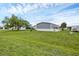 Nice yard with views of surrounding homes and landscaping at 7337 Desant Ln, Port Charlotte, FL 33981