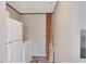 Washer and dryer hookups in room with white refrigerator at 7337 Desant Ln, Port Charlotte, FL 33981