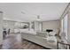 Open-concept living area with sleek furniture, modern flooring, and ample space at 7337 Desant Ln, Port Charlotte, FL 33981