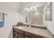 Single sink bathroom vanity with a large mirror, good vibes decor, and updated light fixture at 8228 Villa Grande Ct, Sarasota, FL 34243