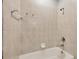 Neutral bathroom with a built-in tub and shower combination, showcasing clean and simple design at 8228 Villa Grande Ct, Sarasota, FL 34243