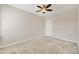 Bright bedroom with a ceiling fan, neutral walls, carpet and a large closet at 8228 Villa Grande Ct, Sarasota, FL 34243