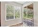 Dining area featuring a large window with backyard views and wine rack at 8228 Villa Grande Ct, Sarasota, FL 34243